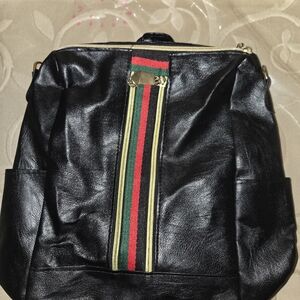 Elegant Black Leather Backpack with Gold Accents